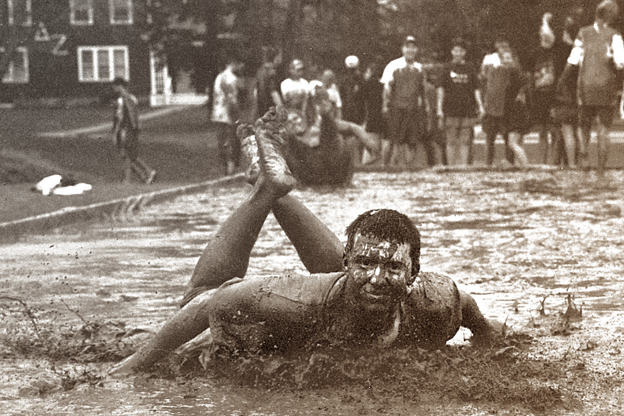 Matt Kenny takes a slide during the 1996 Oozeball tournament, a part of Spring Weekend. (Jonathan Cohen/UConn File Photo)