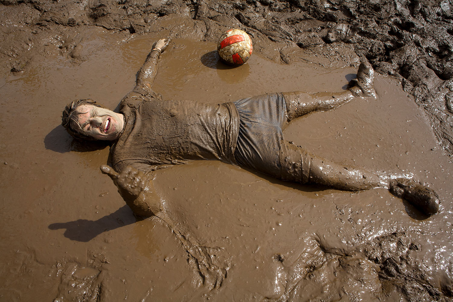 oozeball participant in the deep mud